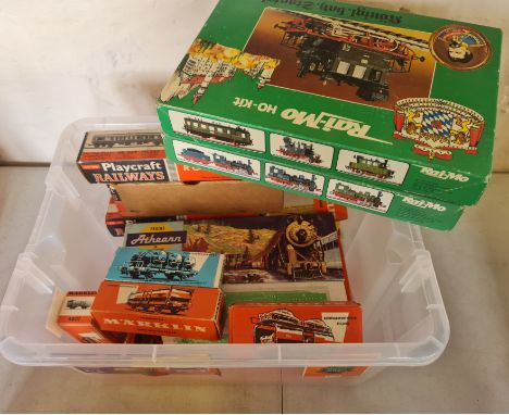 A box containing a quantity of model train items.