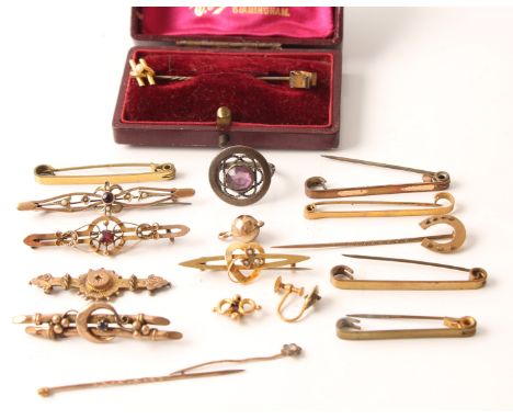 A collection of brooches and stick pins, some set with gemstones, some stamped 9ct/375, along with some small pieces of metal