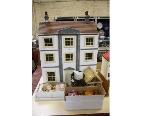 A Georgian fronted three storey doll's house, with wooden furniture, a greenhouse with garden tools and a dismembered doll. 
