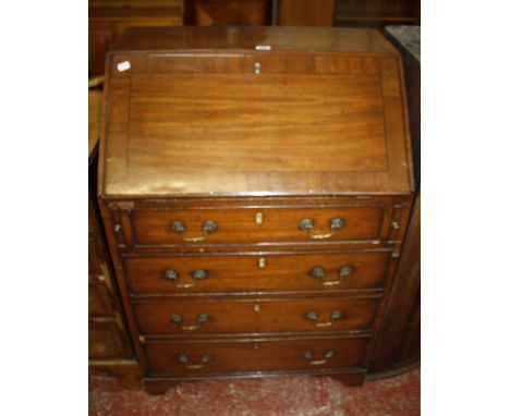 A 19th Century mahogany and ebonised bureau with a sloping fall and four long drawers on bracket feet 70cm wide  