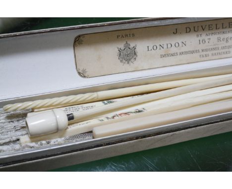 A mother of pearl and lace fan in original box, six chopsticks, a crochet hook and an ivory cheroot holder marked Dunhill  