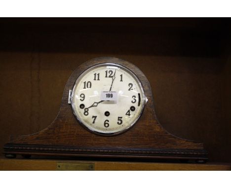 Two oak cased mantel clocks and a walnut cased Art Deco design mantel clock. (all working and recently serviced) 