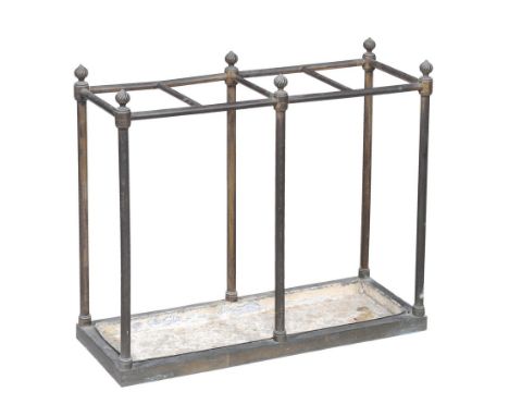 A brass stick stand, 19th century, with gadrooned twist finials above four sections and pillar supports on plinth base with d