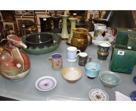 A quantity of studio pottery, to include Rye Pottery, St Andrews pottery, a model of a grebe, candlesticks, and bowls. 
