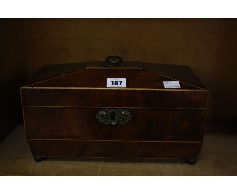 A George IV mahogany tea caddy, sarcophagus shaped, 30.5cm wide  