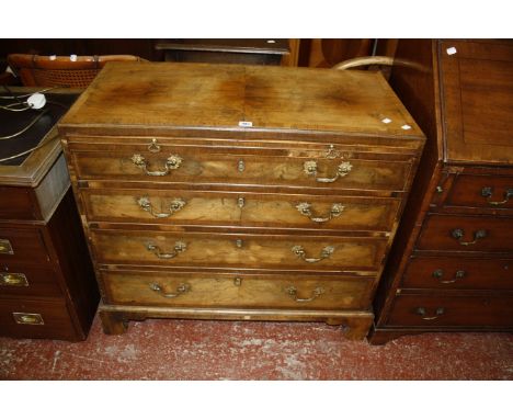 An 18th Century walnut and crossbanded chest with a brushing slide and two short and four long drawers on bracket feet 95cm w