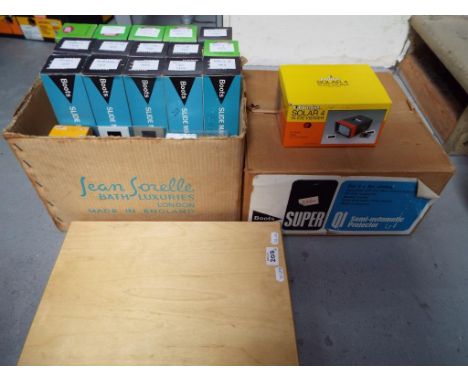 A lot to include a Boots Super IQ semi automatic slide projector, a large quantity of photographic slides and wooden slide bo