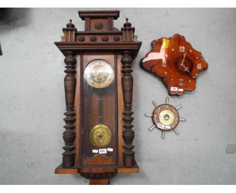 A lot to include an oak cased wall clock, an unusual clock formed from a section of tree trunk and a ship's wheel barometer (