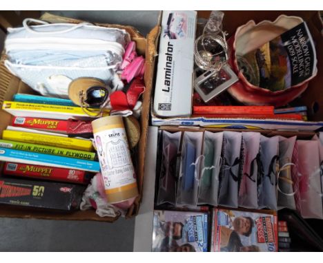 A mixed lot to include ceramics, glassware, DVDs, vintage jigsaws, gift bags and similar [3].