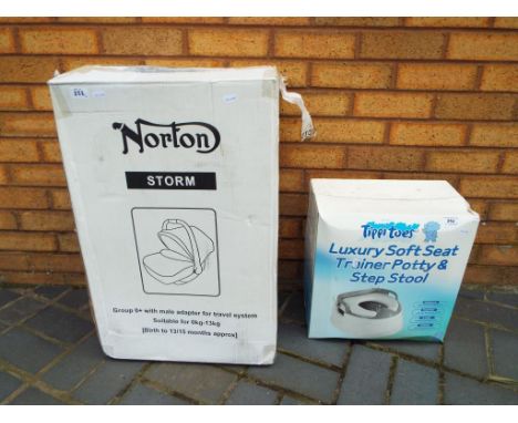 A boxed Norton Storm child's car seat and a boxed Tippi Toes luxury soft seat training potty and step stool (2)