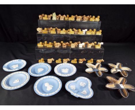 A quantity of Wade Whimsies, a trinket dish and six powder blue Wedgwood Jasperware pin dishes