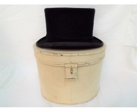Lock &amp; Co - A vintage Lock &amp; Co, St James's Street, London top hat contained in oval, metal hat box, interior circumf