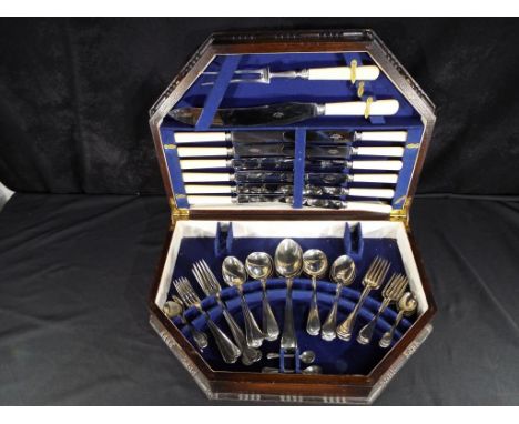 A large good quality wooden canteen of cutlery with blue interior circa 1960s comprising six dinner knives and forks, six tab