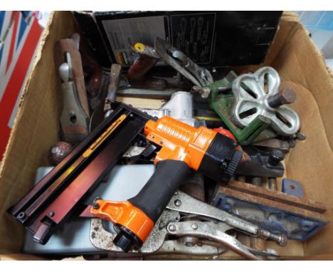 A box containing a quantity of hand tools.
