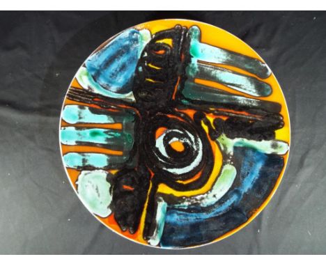 A large Poole pottery charger stamped to the base, approx 36cm (d)
