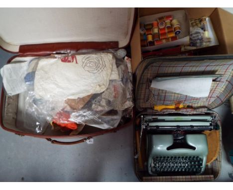 A vintage suitcase containing a quantity of crafting and sewing equipment and an Oliver MT13 typewriter in case [3]