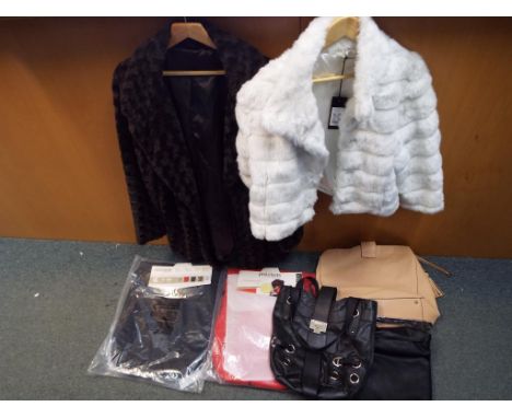 Two Phil &amp; Teds cosy toe foot muffs sealed in original packaging, three lady's handbags one marked Whisper another Jimmy 