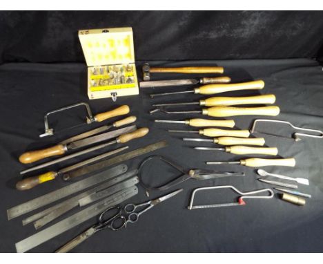 A quantity of tools to include Robert Sorby wood turning tools, files, saws and similar, Est £60 - £100.