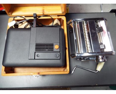 A Zeiss Ikon Perkio projector, contained in wooden carry case and a pasta maker [2].