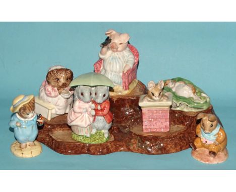 A collection of seven Beswick Beatrix Potter figures: 'Little Pig Robinson - Spying', 'Goody &amp; Timmy Tiptoes', 'Mrs Tiggy