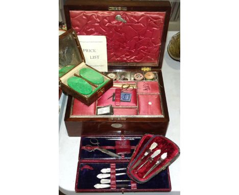A Victorian rosewood sewing and work box containing haberdashery, two cased mother-of-pearl-handled manicure sets and a green