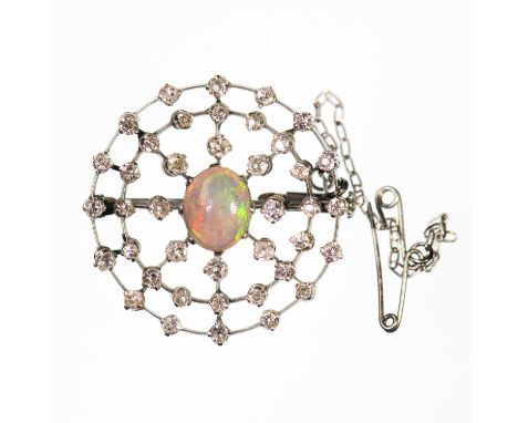 AN EARLY 20TH CENTURY OPAL AND DIAMOND BROOCH an oval opal within a knife-edge halo frame of old-cut diamonds. Estimated tota