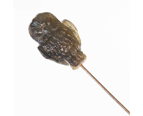 A LABRADORITE OWL STICK PIN Unmarked, head measures 2.7cm by 1.2cm, overall length 8.5cm, 8.2 gramsGood condition.