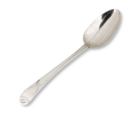 A GEORGE III SILVER TABLESPOON by Hester Bateman, London 1784, Old English pattern, with bright-cut engraved decoration. 21.5