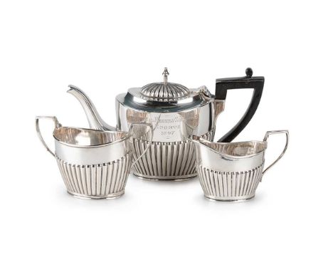 A LATE VICTORIAN SILVER THREE-PIECE BACHELOR'S TEA SERVICE by Charles Boyton (II), London 1897, comprising teapot, twin-handl