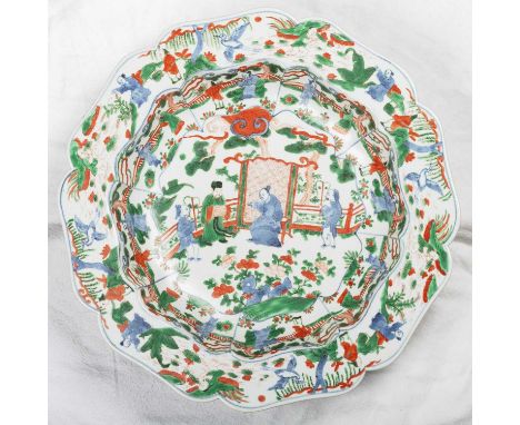 A CHINESE FAMILLE VERTE BASIN shaped octagonal form, painted in the typical palette with figures, in Japanese box. 40cm diame