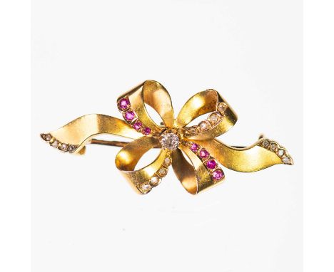 A RUBY AND DIAMOND RIBBON BOW BROOCH a brush-polished ribbon bow accented with diamonds and rubies. Estimated principal diamo