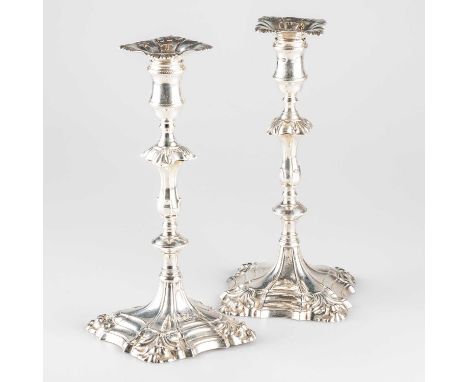 A PAIR OF GEORGE II CAST SILVER CANDLESTICKS by William Cafe, London 1758, each with original sconce and knopped stem issuing