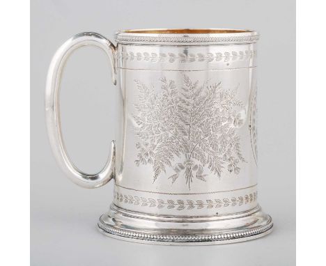 A VICTORIAN SILVER MUG maker's mark erased, London 1875, cylindrical form with loop handle, raised on a spreading circular fo