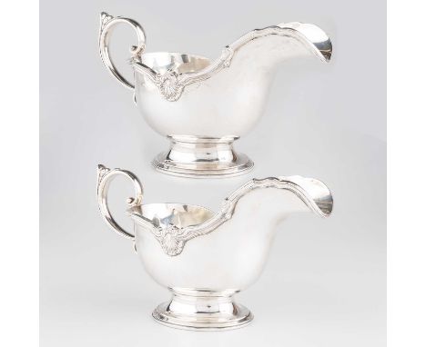 A PAIR OF GEORGIAN STYLE SILVER SAUCEBOATS by Mappin &amp; Webb Ltd, Sheffield 1953, of heavy gauge, each with reeded and she