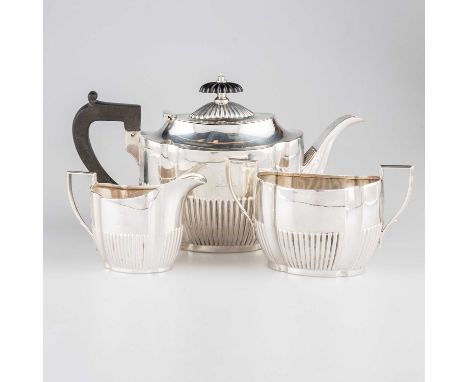 AN EDWARDIAN SILVER THREE-PIECE BACHELOR'S TEA SERVICE by George Howson, Sheffield 1901, comprising teapot, cream jug and two