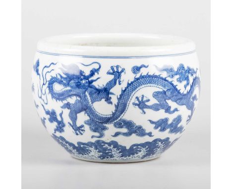 A CHINESE BLUE AND WHITE JARDINIÈRE, DAOGUANG MARK AND PERIOD, 19TH CENTURY finely painted with twin dragons amidst clouds ab