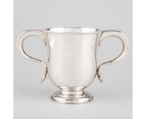 A GEORGE I SILVER TWO-HANDLED CUP by Thomas Tearle, London 1723, the plain body with scroll-form handles and domed circular f