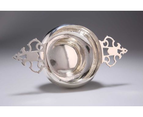 A VICTORIAN SILVER QUAICH by Susannah Brasted, London 1892, of bellied circular form with twin pierced handles, engraved with