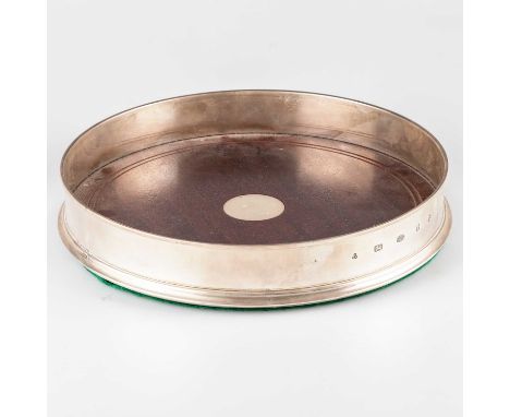 AN ELIZABETH II SILVER-MOUNTED TABLE COASTER by M C Hersey &amp; Son Ltd, London 2004, plain circular form with hardwood base