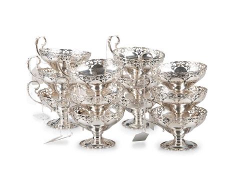 A SET OF TWELVE GEORGE V SILVER SUNDAE DISHES by Mappin &amp; Webb Ltd, Sheffield 1934, each with fancy pierced rim and shape