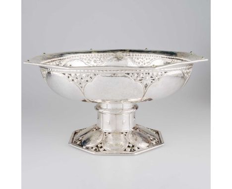 A LARGE SILVER BOWL unmarked, octagonal, the rim picked out with eight green cabochon stones above pierced and chased sides, 