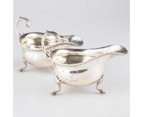A PAIR OF GEORGIAN STYLE SILVER SAUCEBOATS by J B Chatterley &amp; Sons Ltd, London 1934, each with gadrooned rim and leaf-ca