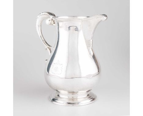 A GEORGE III SILVER BEER JUG possibly by William Cattell, London 1781, of baluster form with leaf-capped scroll-form handle, 