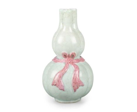 A CHINESE CELADON GOURD VASE of lobed form, moulded with a ribbon-tied waist, the upper section with three clustered necks, b