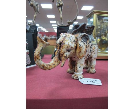 Cast Iron Money Box, in the form of an elephant and howdah, tail operates the trunk to feed coins to body, 20.5cm long
