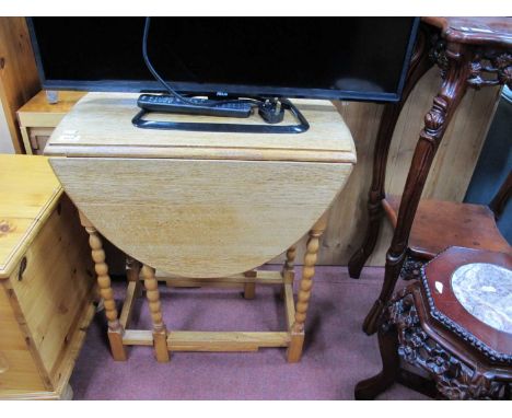 1930's Oak Gate Leg Table, with drop leaves, on bobbin and block supports.