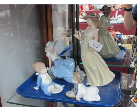 Four Nao Figures - young girls, baby girl and baby eating, all boxed.