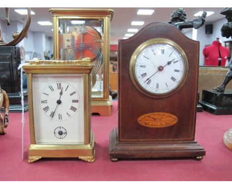 A Brass Cased Carriage Clock, with a white dial and Roman numerals, scroll feet, together with an Edwardian mahogany mantle c