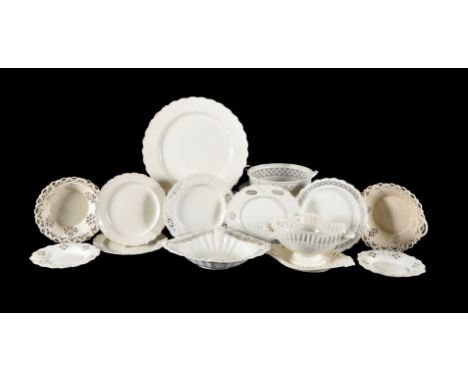 A selection of Staffordshire and South Yorkshire creamware, mostly late 18th century, including baskets, plates and stands an