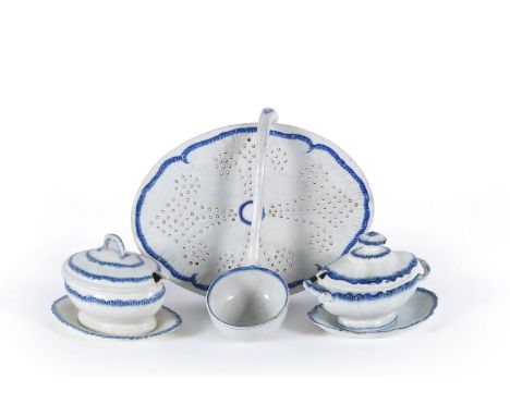 Four items of Staffordshire pearlware, circa 1790, comprising: a drainer, 32cm in length; two various small tureens, covers a